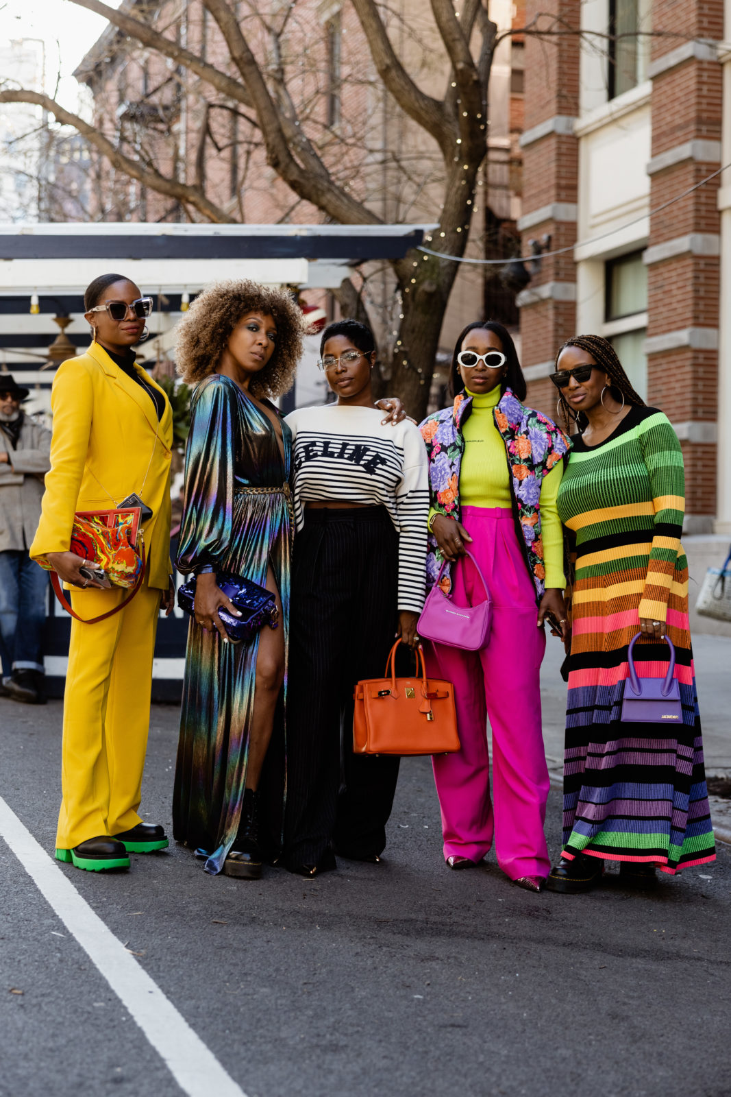 Two women in bold street-style looks during fashion week